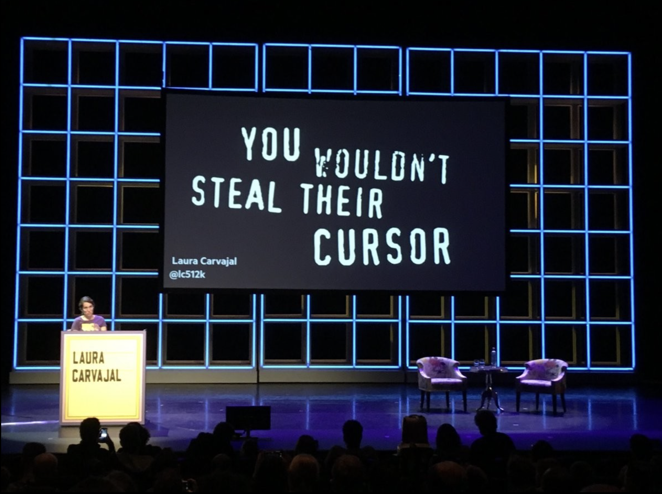 Laura Carvajal on stage at Fronteers 2018, with a slide on screen behind her that says 'You wouldn't steal their cursor'