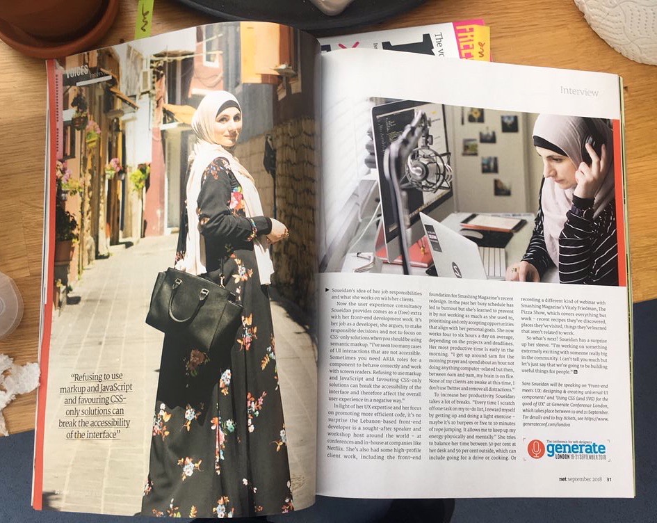 A physical copy of net magazine on a desk, opened to featured interview with Sara.