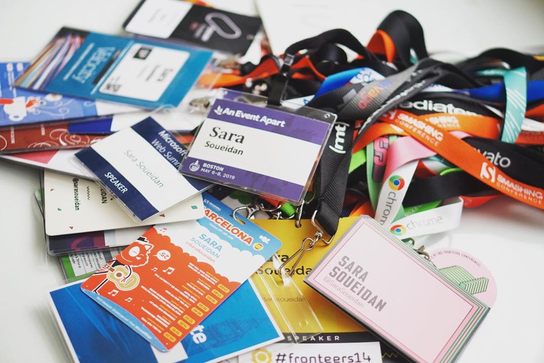 A collection of Sara’s speaking lanyards